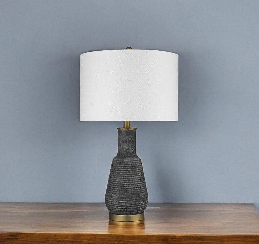 26" Distressed Black and Gold Ceramic Table Lamp With White Drum Shade HomeRoots