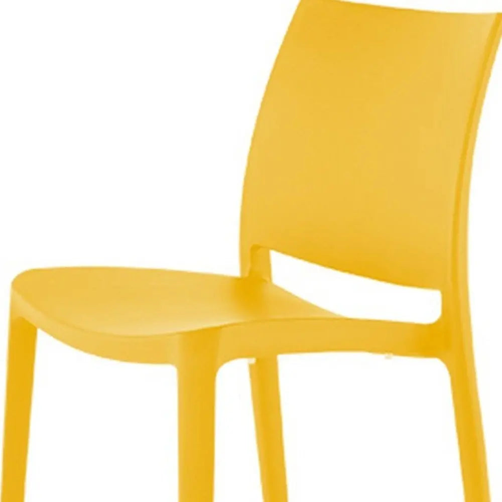 Set of Four Gold Heavy Duty Plastic Outdoor Stacking Dining Chairs - NOBLE HOME INTERIORS
