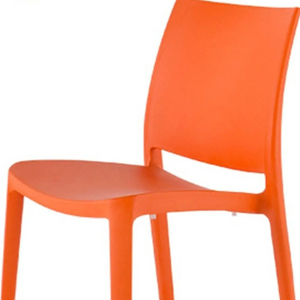 Set of Four Orange Heavy Duty Plastic Outdoor Stacking Dining Chairs - NOBLE HOME INTERIORS