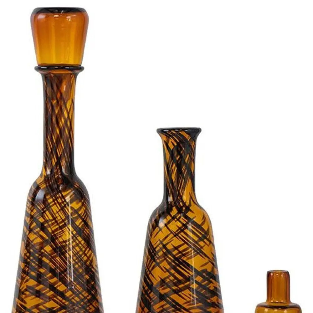 Set of Three Amber Abstract Swirl Glass Decorative Bottles With Stoppers - NOBLE HOME INTERIORS
