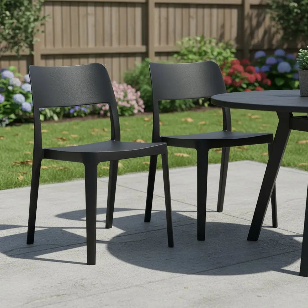 Set of Two Black Heavy Duty Plastic Outdoor Stacking Accent Chairs - NOBLE HOME INTERIORS