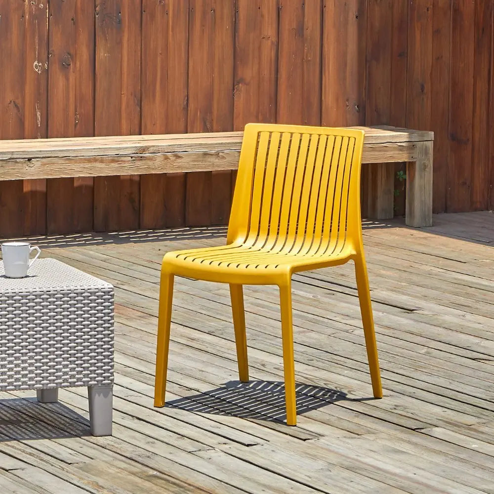 Set of Two Gold Heavy Duty Plastic Outdoor Stacking Accent Chairs - NOBLE HOME INTERIORS