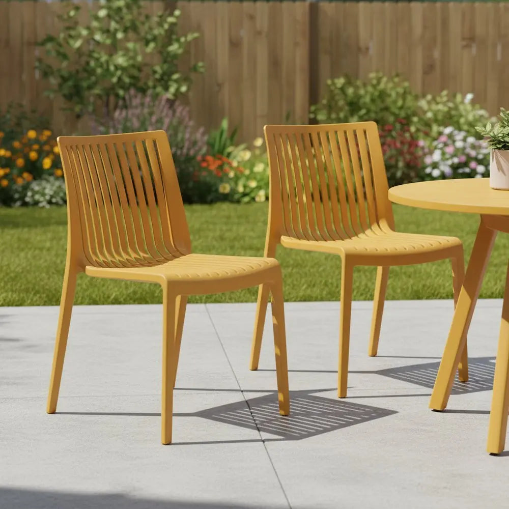 Set of Two Gold Heavy Duty Plastic Outdoor Stacking Accent Chairs - NOBLE HOME INTERIORS