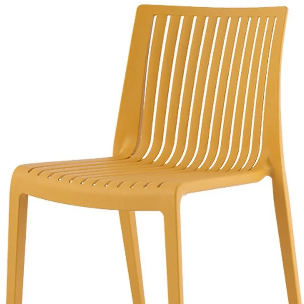 Set of Two Gold Heavy Duty Plastic Outdoor Stacking Accent Chairs - NOBLE HOME INTERIORS