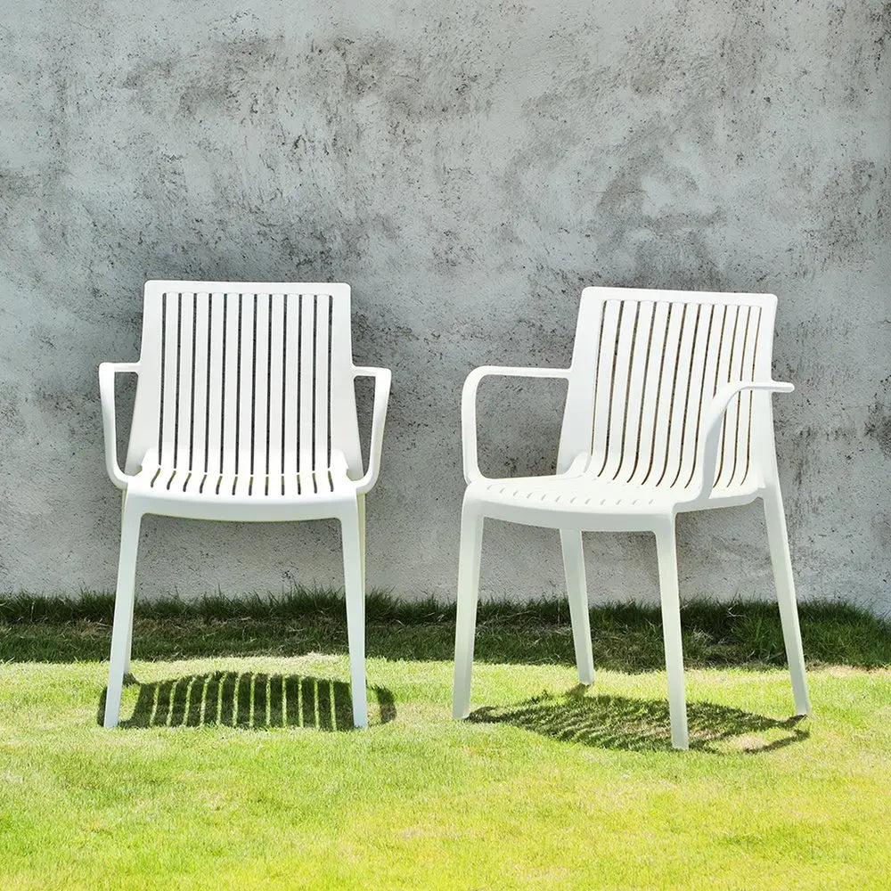 Set of Two White Heavy Duty Plastic Outdoor Stacking Arm Chairs - NOBLE HOME INTERIORS